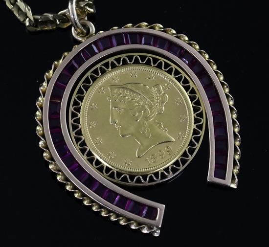 A gold and synthetic ruby? set horseshoe pendant with inset with 1899 United States of America Liberty coin, on a 9ct gold chain,